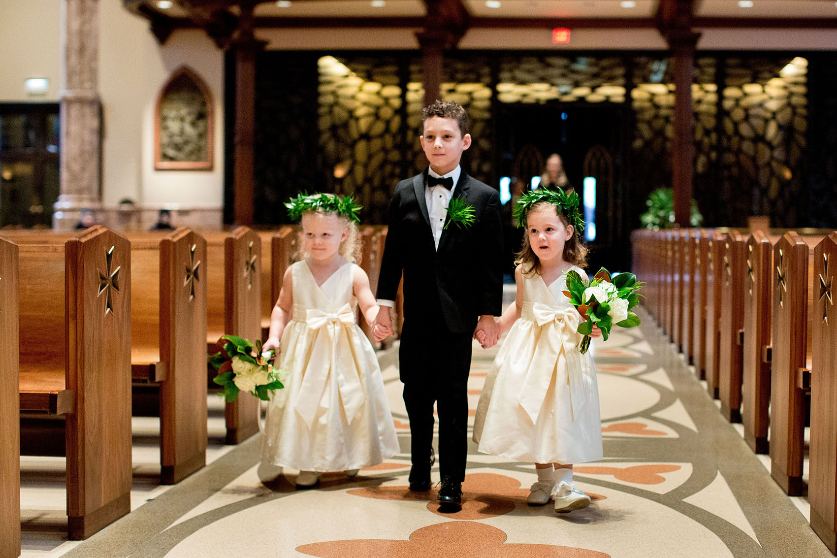 flower girls wearing green leaf crowns at a holy name cathedral wedding