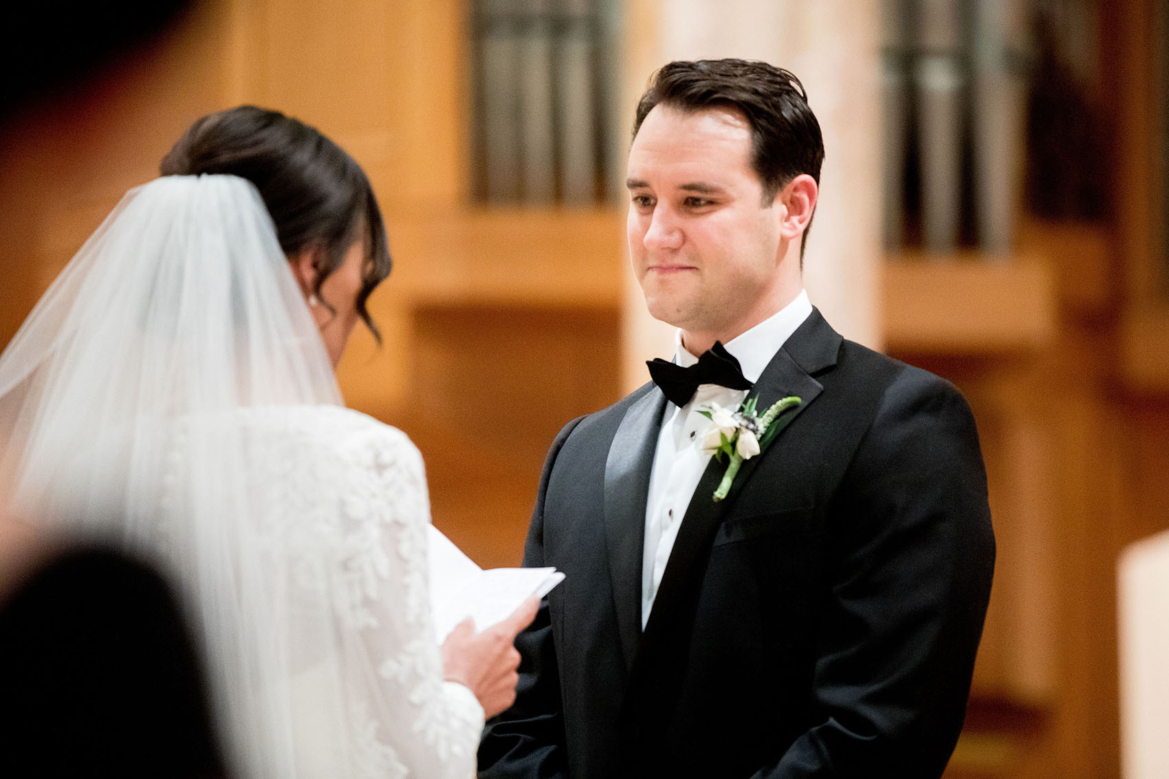 photo of a groom looking at bride during a holy name cathedral documentary wedding