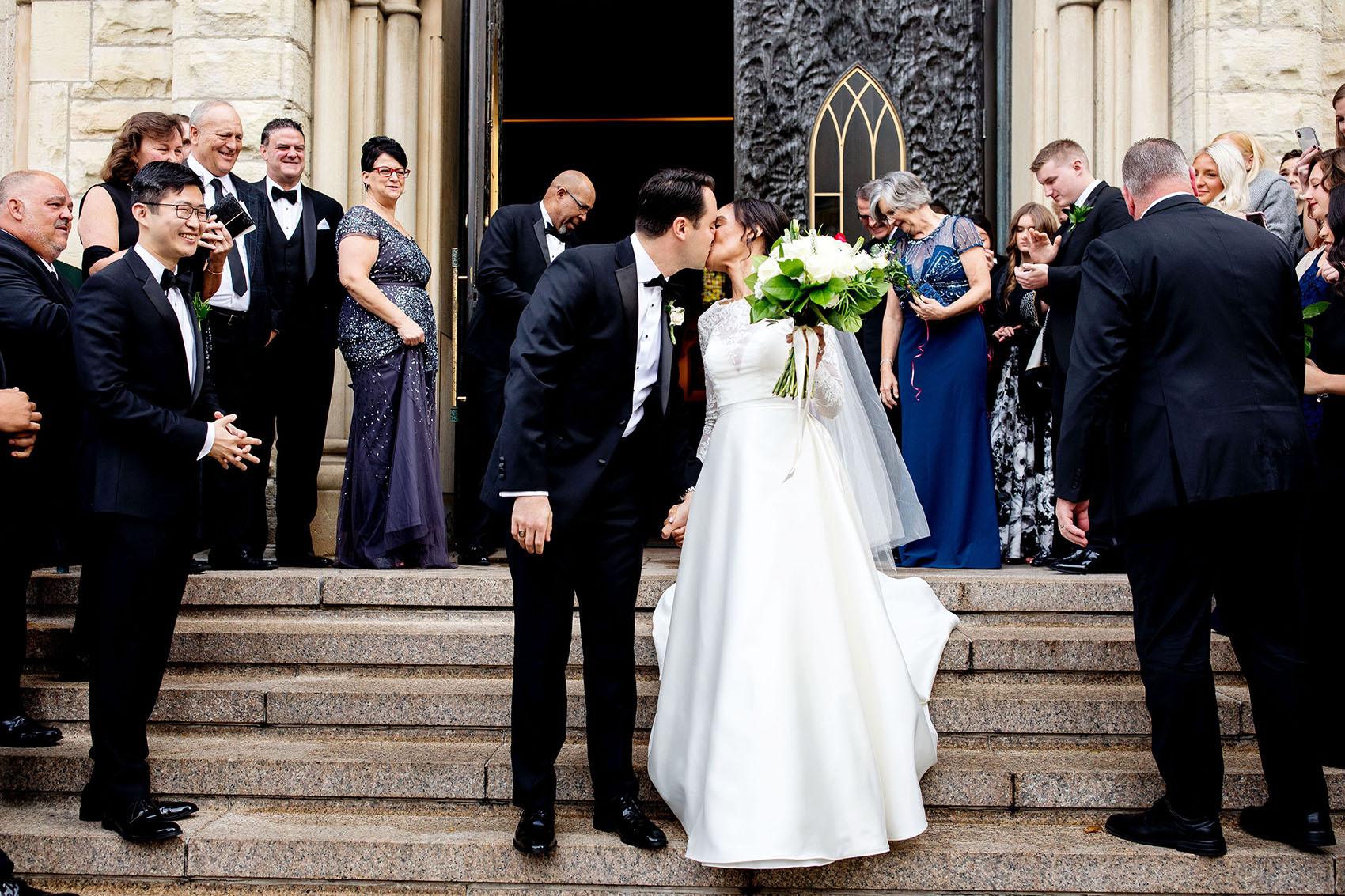 bride and groom exiting a holy name cathedral chicago wedding