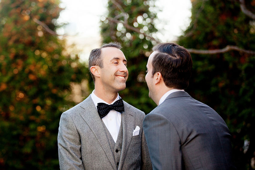 a first look of two grooms by chicago wedding photographer