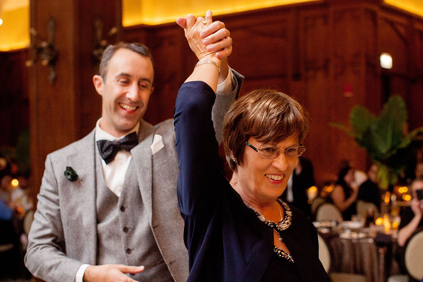 wedding photos of a groom and mom dancing at the chicago athletic association hotel