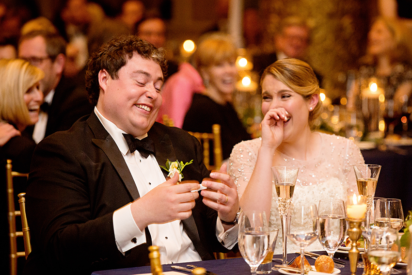 couple laughing at toast at the drake